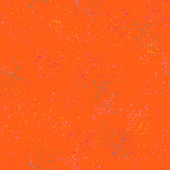 Pattern of multi-colored speckles on an orange background