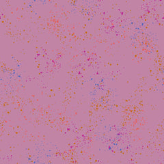 Pattern of multi-colored speckles on a light purple background