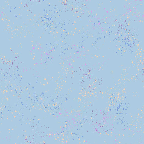 Pattern of multi-colored speckles on a light blue background