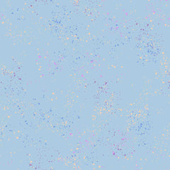 Pattern of multi-colored speckles on a light blue background