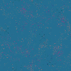 Pattern of multi-colored speckles on a blue background