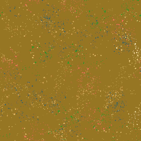 Pattern of multi-colored speckles on a light brown background