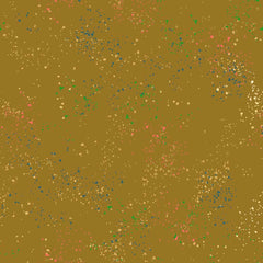 Pattern of multi-colored speckles on a light brown background