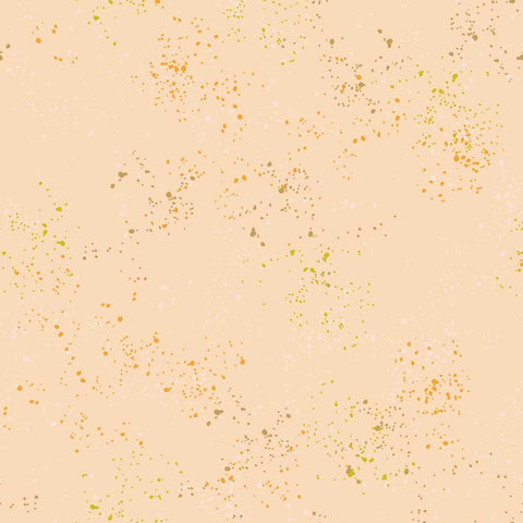 Pattern of multi-colored speckles on a light pink background