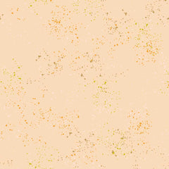 Pattern of multi-colored speckles on a light pink background