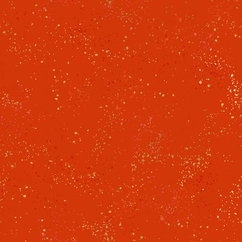 Pattern of multi-colored speckles on a red background