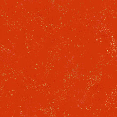 Pattern of multi-colored speckles on a red background