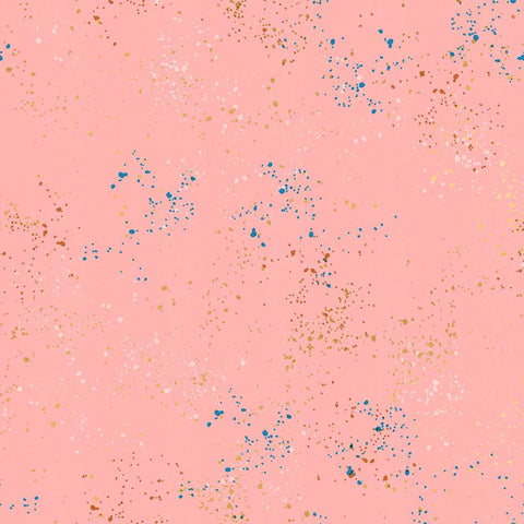 Pattern of multi-colored speckles on a pink background
