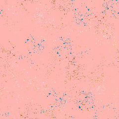 Pattern of multi-colored speckles on a pink background