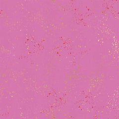 Pattern of multi-colored speckles on a light purple background