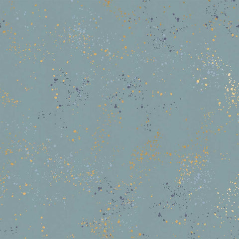 Pattern of multi-colored speckles on a light blue background
