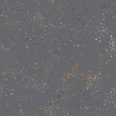 Pattern of multi-colored speckles on a dark gray background
