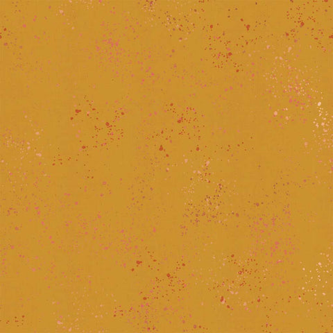 Pattern of multi-colored speckles on a gold background