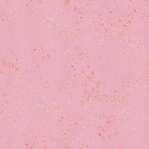 Pattern of multi-colored speckles on a pink background
