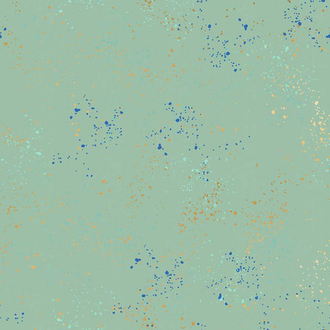 Pattern of multi-colored speckles on a light blue background
