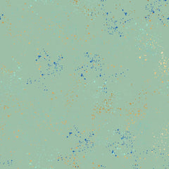Pattern of multi-colored speckles on a light blue background