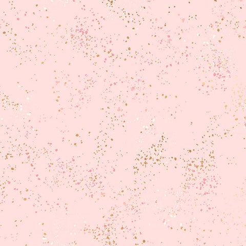 Pattern of multi-colored speckles on a light pink background