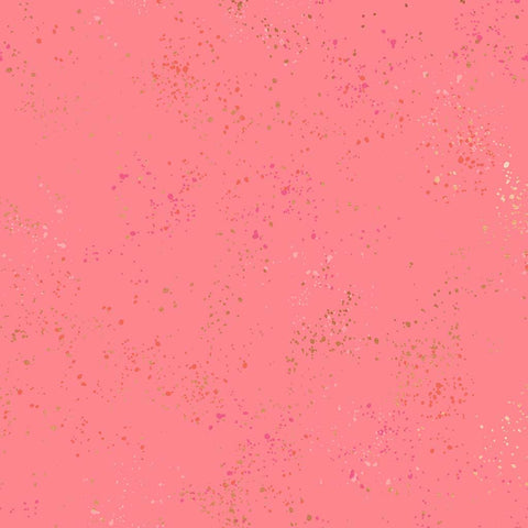 Pattern of multi-colored speckles on a pink background