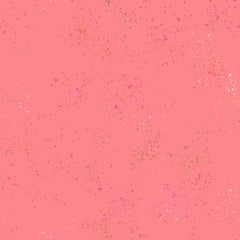 Pattern of multi-colored speckles on a pink background