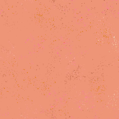Pattern of multi-colored speckles on a peach background