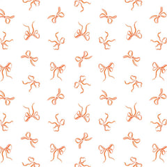 Pattern of pink bows on a white background