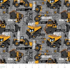 Pattern of Tonka construction vehicles on a gray background with ruler