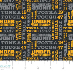 Pattern of 'Under Construction' and other text in yellow and gray on a black background with ruler