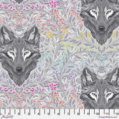 Pattern of wolf heads with colorful leaves on a gray background