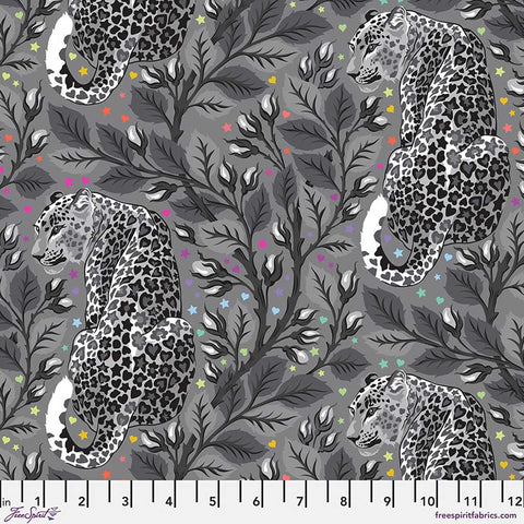 Leopard pattern fabric with leaves and flowers on a gray background